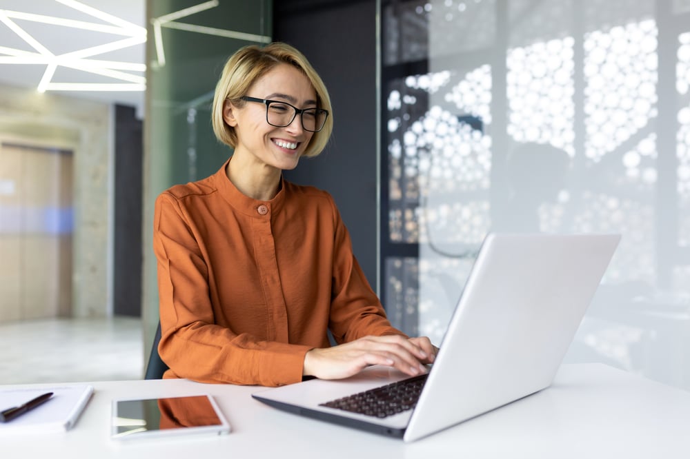 happy-and-smiling-businesswoman-typing-on-laptop-2023-11-27-05-29-55-utc (1)